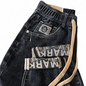 Band Jean 2023 Nouveau style décontracté jeans en vrac Men de taille élastique imprimée pantalon harem polyvalent fi hip hop streetwear hot l4fh #