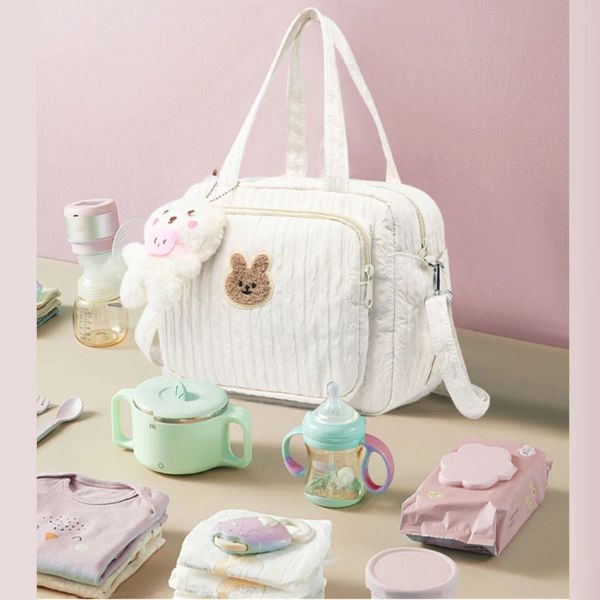 Bolsas 1pc de color sólido Bolsas de pañales para bebés Bolsas de maternidad Cartoon animales de nylon nylon Mom Bolsa de viaje con colgante