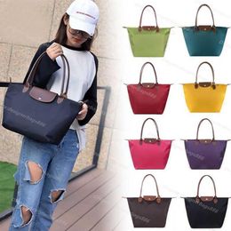 Bolsas Bolso de marca clásico Mujer Cuero genuino Plegable Impermeable Nylon Gran almacenamiento Caballo 70 aniversario Compras Sling Bag268t