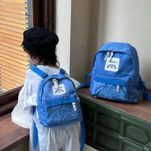Sacs Doraemon Schoolbag pour les élèves du primaire Light Small Sac à dos Couleur solide dessin animé Baby Baby Fashion Sac à dos