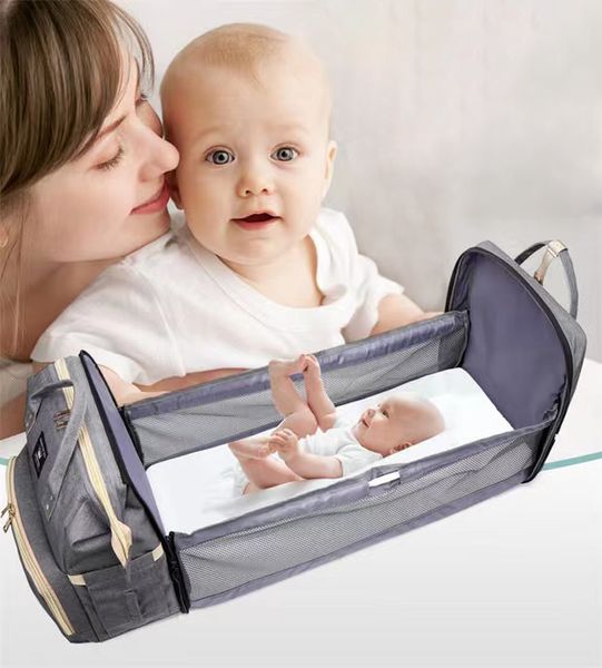 Sacs Momie Sac Designer Sac à dos Multifonctionnel Mère et bébé Baby Berceau pliable Gardez des poches multiples chaudes.