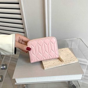 Bolsos tienda Outlet cartera pequeña de cuero suave para mujer 2023 nuevo diseño de nicho cremallera de alta belleza dinero de mujer Clip corto japonés
