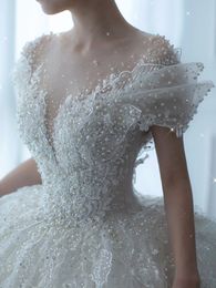 Ball Dubai Princess Robe de mariée Robe de mariée perles pailled V Col à manches longues Perles Bridal Robes Crystal Bride Robes