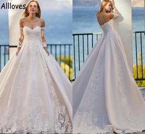 Robes de mariée robe de bal avec manches longues en dentelle Appliqued robes de mariée grande taille CL0955