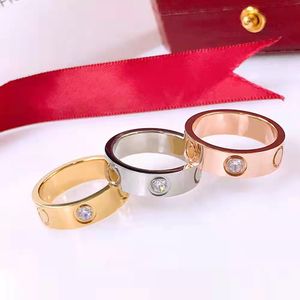 Banda Anillos de amor Joyería de diseño Oro rosa Chapado en plata Acero de titanio con diamante Moda Calle hip hop pareja casual Anillo fino clásico Mujeres amor anillo de tornillo para hombre