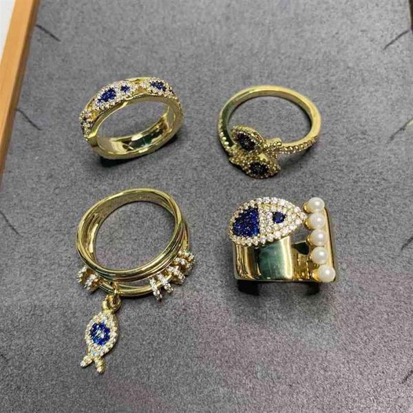 Anillos de banda Familia de dedo Un círculo giratorio de múltiples capas Romántico Peces pequeños Mujer Lucky Pearl Apertura Piscis Batch252A