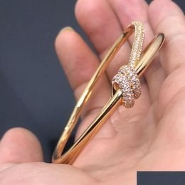 Brangle de bracelet en diamant à nœuds Bangle TC Twisted Gold Jewelry Woms Charms Luxury Have Bijoux Couple Drop Livraison Bracelets Otkch