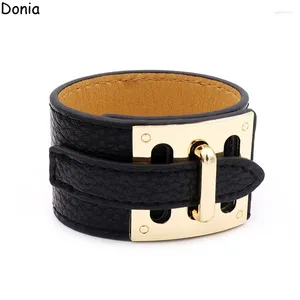 Bangle donia sieraden Europese en Amerikaanse mode 316L roestvrijstalen knoppen brede lederen touw high-end armband.
