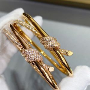 Bangle Europese rose gouden touw knoop armband dames high-end mode luxe merk hoogwaardige sieraden feestcadeau 231005