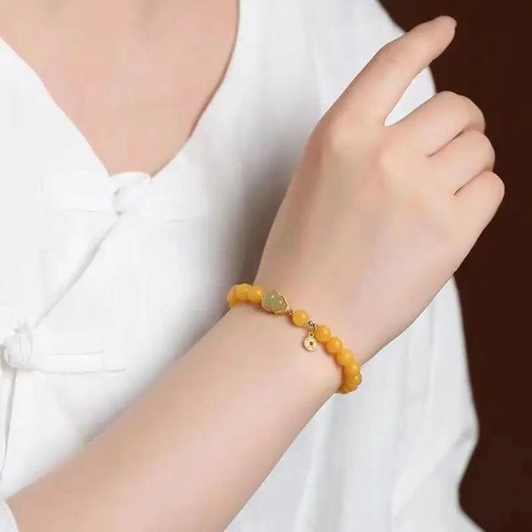 Brazaletes Pulsera de cera de abejas natural Aceite de pollo de miel vieja para mujer Amarillo Hetian Jade Calabaza HandString Ganar dinero Fu Antiguo Regalo de novia