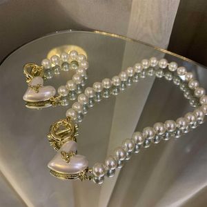 Baroque Designer Pearl Heart Pendant Collier Love Planet Forme Ot Boucle Bracelet Chaîne de couchage Chaîne de mode Bijoux 274I