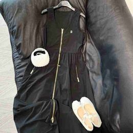 Robes décontractées de base Marque de designer Robe de style Miu Hepburn pour femmes 2023 Été Nouveau gilet sans manches avec cordon élastique avec jupe à demi-fermeture à glissière W9ZE