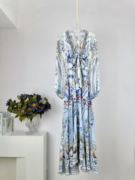 Robes décontractées de base Design design Nouveau printemps / été enveloppe imprimée en soie à cravate longue robe