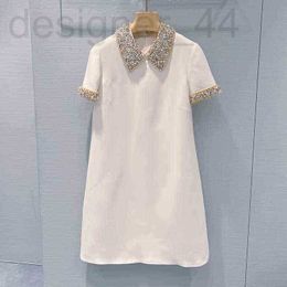 Robes décontractées de base robe blanche luxueuse faite à la main Diond clouté prl lerity jupe tempérée revers slim suer OL2M