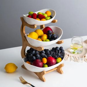 Paniers Ensemble de bols de panier de fruits en céramique à 3 niveaux avec support en bois, plat de bonbons servant le support de bol de fruits de cuisine support de rangement en bois