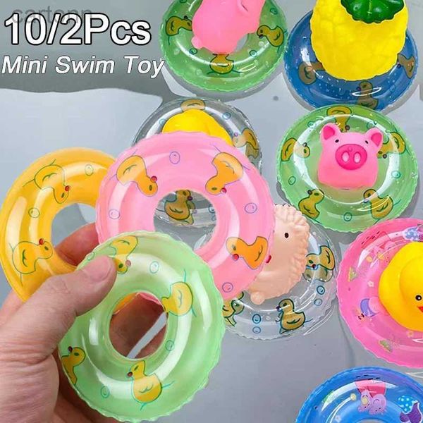 Toyos de baño Mini Círculo de natación juguete Babby Kids Funny Swimming Doll Swimming Float Toys Flotating Rubber Bail Pool Inflable Toy 240413