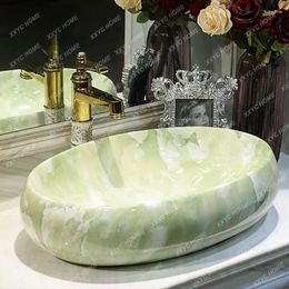Robinets d'évier de salle de bains, lavabo en céramique Imitation marbre lavage du visage Art inter-plateforme ovale ménage
