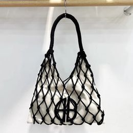 Bolsas de playa para mujeres bolsos de diseño de lujo de lujo 2024 en lienzo trenzado de nylon lienzo trenzado de bolsillo interior de tela de tela de axila 240510