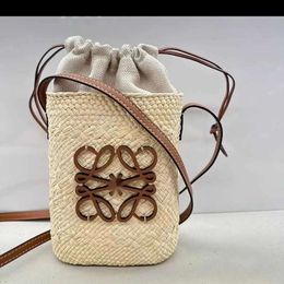 Bolsa de paja de playa Bolsa de diseño de chasquido/verano Bolsa de diseñador de mujer Lafita Fashion Fashion Bucket Basket Bag Bag 230731