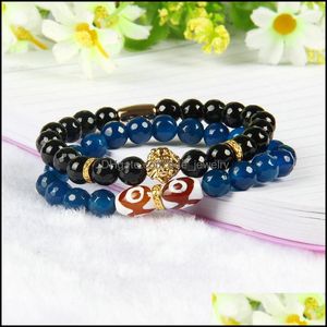 Kralen topkwaliteit sieraden groothandel 8 mm gefacetteerde blauwe en zwarte agaat steen kralen met PVD -vergulde leeuwkoparmbanden voor mannen drop de dhzzt