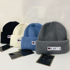 Diseñador de beanie Winter Beanies Gorro de punto para hombres y mujeres Capas de calaveras de moda Letras de la calle Smiling Face Copil