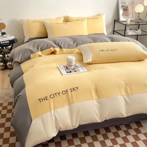 Conjuntos de ropa de cama Proceso de empalme de algodón puro Juego de tres piezas Fuera de cuatro edredones con almohada de sábana amarilla y gris