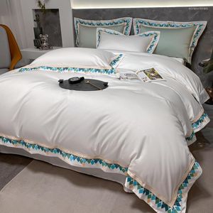 Ensembles de literie pur blanc coton à longues fibres brodé luxe 4 pièces Europe literie housse de couette drap housse draps taies d'oreiller