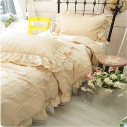 Ensembles de literie Couleur solide volants coréens princesse romantique Lace Broidered Ropa de Cama Bed Jirt beige crème pur coton Set YW