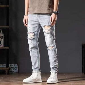 Beggar's Big Hole Color Jeans Heren Lente/zomer Koreaanse mode Slim Fit Small Foot Motorcycle Lichtblauwe lange broek