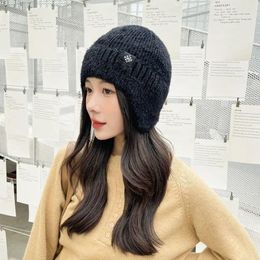 Beretten dikker buitenshuis Winter rijden Bloem gebreide windbreak hoed met oorklappen vrouwen bommenwerper hoeden Koreaanse beanies oor muff doppen