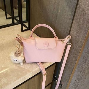 Sac à épaule le mieux vendu Nouveau mini sac de vente directe à 90% Sac pour femmes New Handheld Crossbody Dumpling Phone Zero Wallet Sac