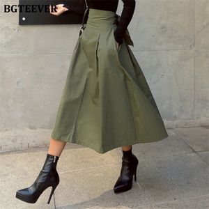 BGTEEVER OL Estilo Cintura alta Bowknot Verde Línea A Faldas Damas Oficina Flare Faldas largas Mujeres Faldas Streetwear 2020 Primavera LJ200819