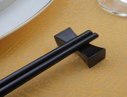 Zwarte kleur eetstokje rust Chinees traditionele kussenvormige kussensvormige stokjeshouder