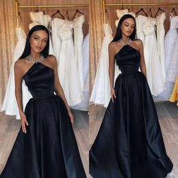 Zwarte jurken sexy mouwloze feestavond prom -jurken plekken een lijn formele lange speciale ocn -jurk