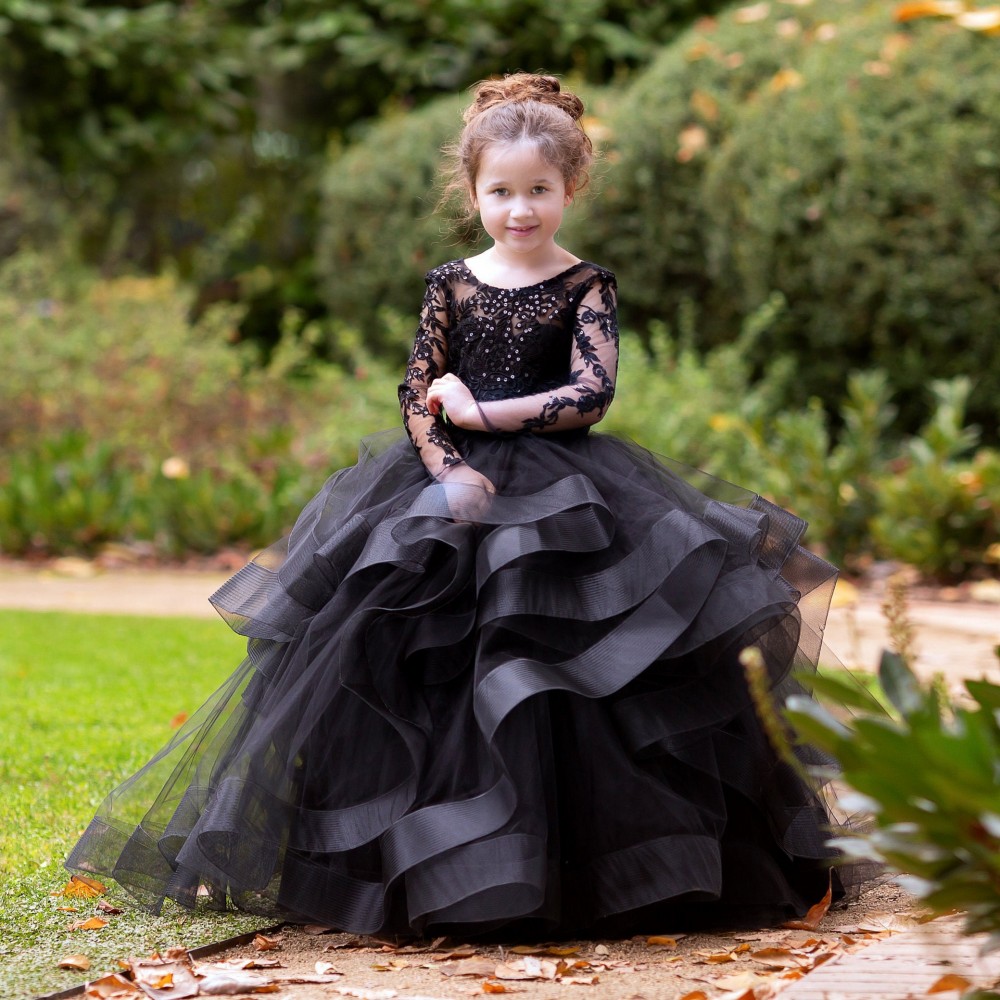Schwarze Blumenmädchenkleider mit Spitzenapplikationen, abgestufte Tüll-Festzugkleider mit langen Ärmeln für die Hochzeit