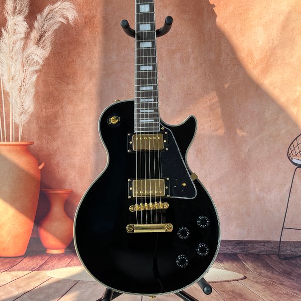 Guitarra eléctrica LP negra, cuerpo de caoba, tablero de palisandro, acabado brillante, herrajes dorados, pastillas HH