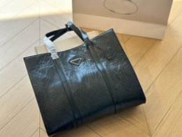 Sac à provisions noir sac fourre-tout design hommes femmes sacs à bandoulière fourre-tout décontracté sac à main de luxe Hobo sacs de haute qualité en peau de vache pochette 231127 240302 240302