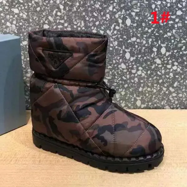 Bota de esquí acolchada para hombre Zapatos para clima frío Invierno Cálido Acolchado Nylon Tobillo Botas para la nieve Diseñador de lujo Moda Edredón antideslizante Medio botines mujeres hombres