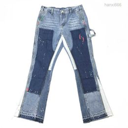Uitlopende jeans met veelkleurige verfspetters en patchwork met acht zakken
