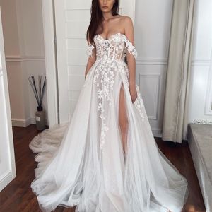 Boheemian Beach Wedding Jurk Side verdeeld van de schouder Ivory Tule A-Line Corset Bridal Jurken Lace Appliques Custom Made Summer Gemaakte Seksuele Backless Robe de Mariee