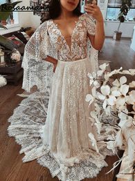 Boheemian Illusion V-Neck korte mouw A-Line trouwjurken met cape Appliques Lace Bridal Jurys Robe de Mariee