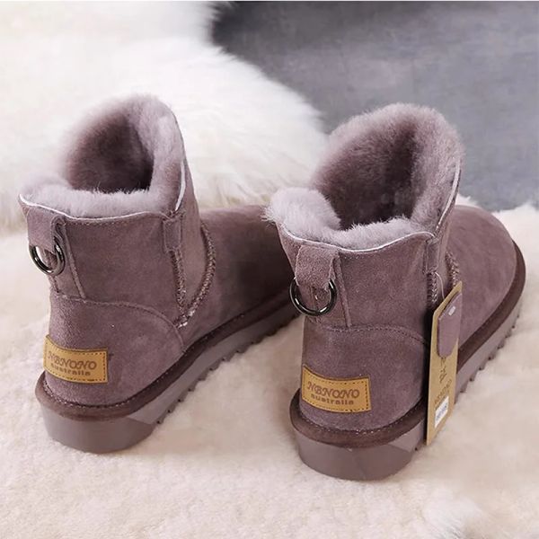 Bottes Nouvelles bottes de neige Style court Mini Mini d'hiver Boots de peau de mouton Femmes Femmes de la cheville en laine naturelle imperméable Fourrure Faute à la cheville chaude chaussure plate