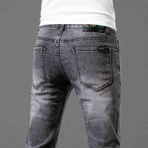 Boutique kwaliteit heren jeans lente en zomer dunne slanke fit kleine voeten elastische vrije tijd trend dubbele g borduurbroek broek