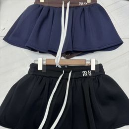 Boutique jupe mini jupe courte des femmes vedette élastique de style fille douce de style fille couleurs de style polyvalent