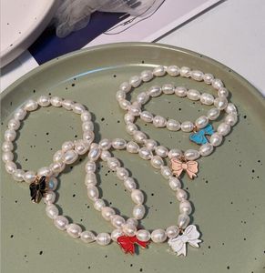 Bracelet en perles d'eau douce, pendentif en forme de nœud, brins de perles blancs, élastique extensible, bijoux à la mode pour mariage, 6-7mm