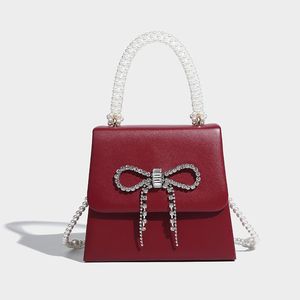 Bolso con cadena de mano con perlas y pajarita, bolso de boda de Nuevo rojo, bolso de hadas de calidad, 2023