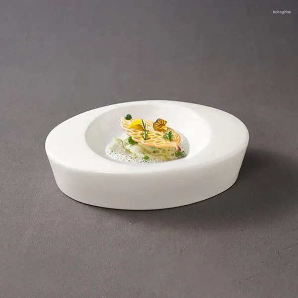 Bols créatifs en céramique blanc double ovale bol à l'épreuve de l'échappement, l'ouest français est servi avec des plats de conception artistiques et des vaisselle.