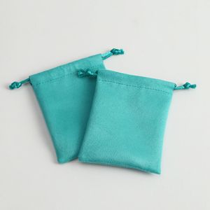 Cajas 50pcs bolsas de joyería de franela Velvet verde Bolsa de sorteo de Navidad Bag Bolsáticas de regalos de negocios