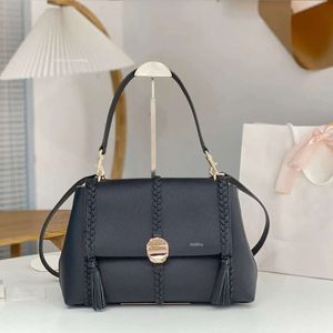 Marca de lujo 7a 1: 1 Hangbag Diseñador para mujer Piel de becerro Bolsas de hombro Cuero de vaca Moda Tote Bolso Borla Cuero genuino Mango Trenza Bolsa de calidad superior