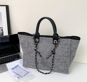 Bolso de mano portátil de gran capacidad con perlas de lona de marca, bolsos de playa al por mayor